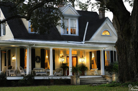 Clermont Bluffs Bed And Breakfast Association Of Mississippi Exterior Of White Victorian Home With Front Porch Lights On